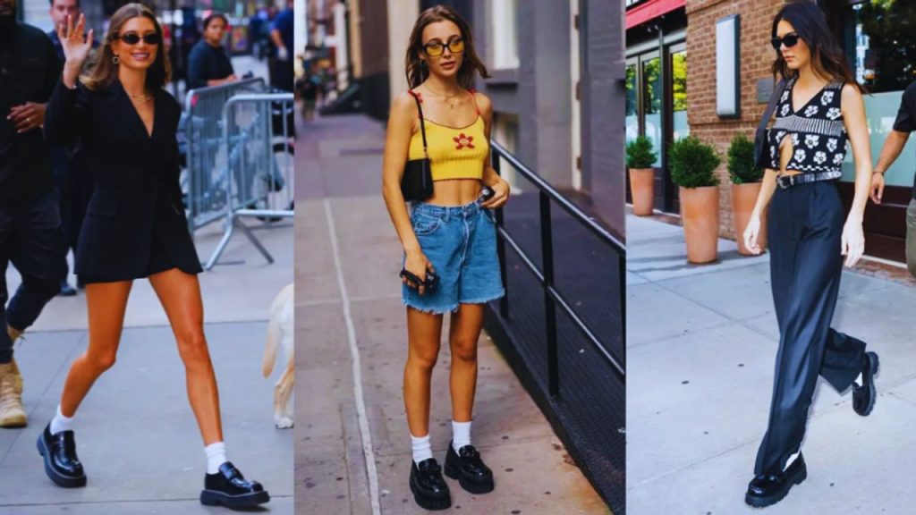 Chunky black loafers paired with a pleated skirt and white crew socks, highlighting the New Preppy aesthetic with sophistication and street-style edge.