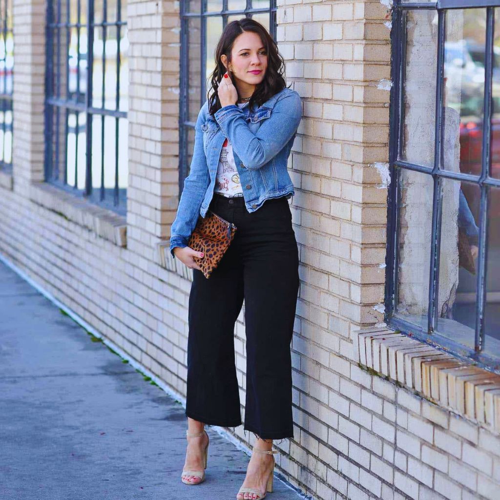 Person wearing cropped wide-leg pants with ankle boots, creating a modern and balanced silhouette.