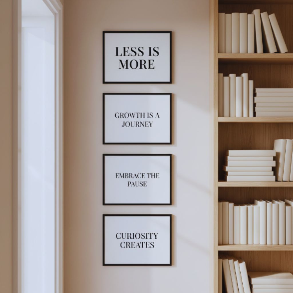 Vertical column of framed quote prints beside a doorway, creating a sleek and space-saving decor layout.