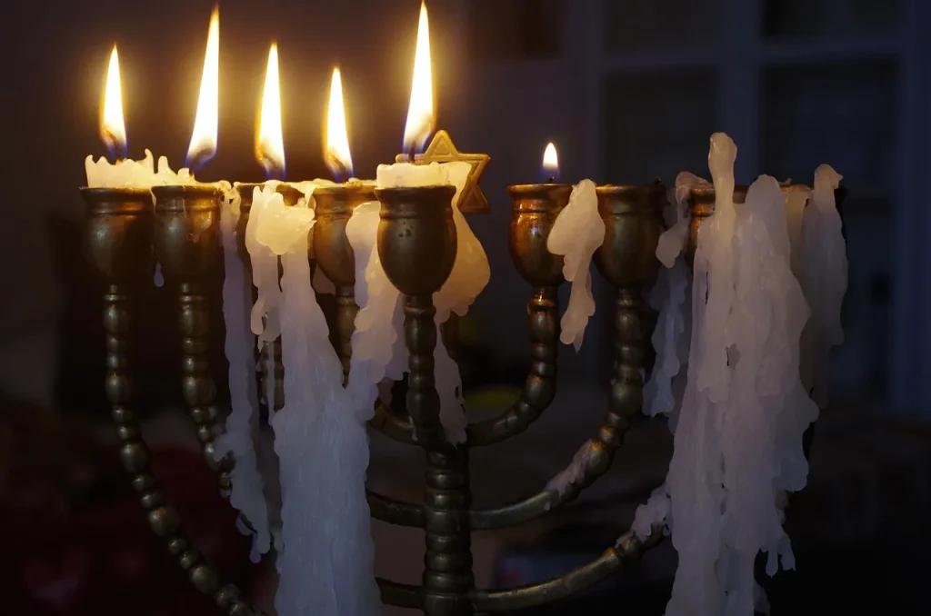 Traditional Hanukkah menorah with melting candles symbolizing the Festival of Lights”