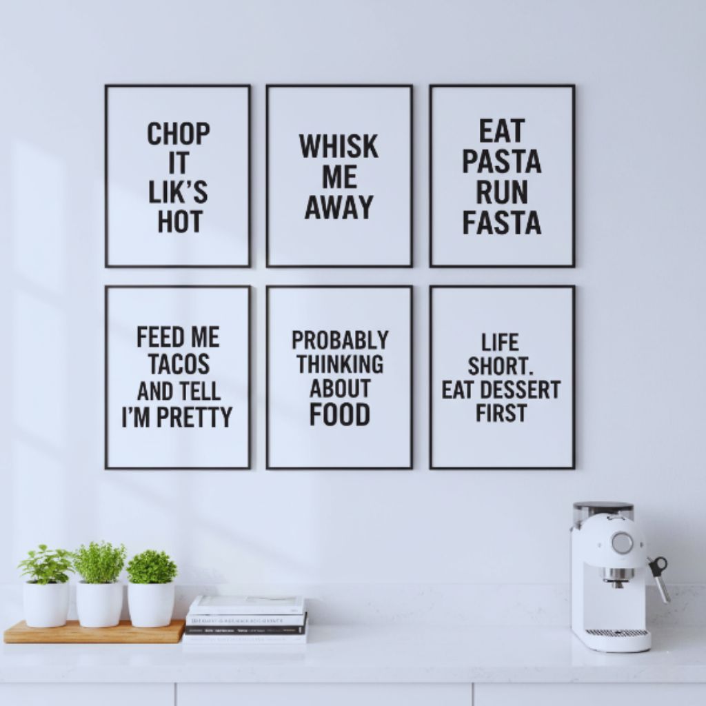 “Modern kitchen wall with black and white typography food quote prints.”