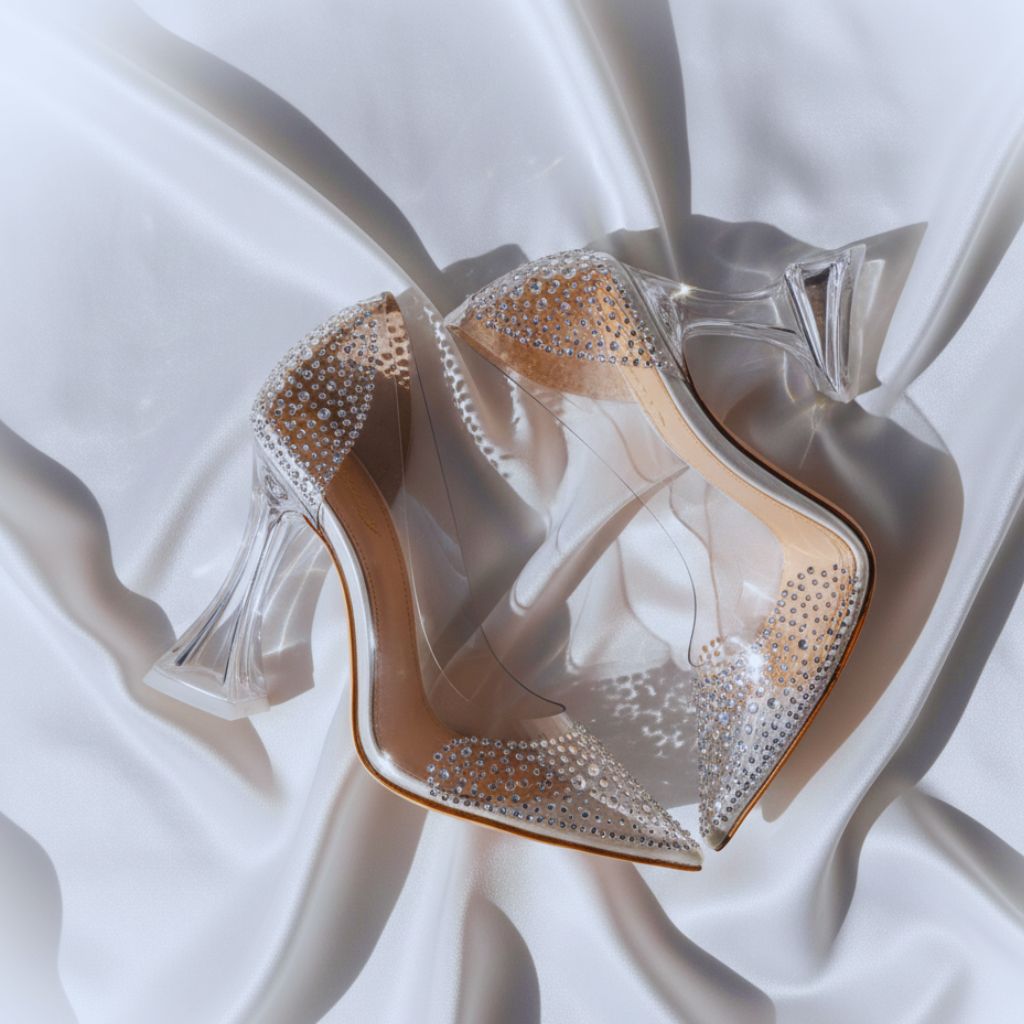 “Transparent rhinestone heels with flared heel design styled on satin fabric as Amina Muaddi dupes.”