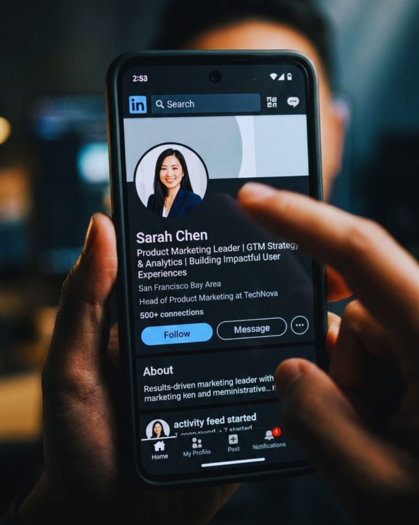 Person evaluating a professional profile on smartphone demonstrating snap digital first impressions.