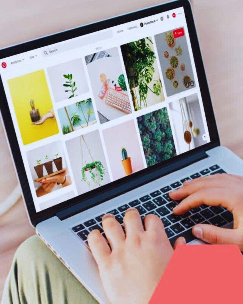 Entrepreneur researching Pinterest SEO keywords to optimize pins and boards for traffic.